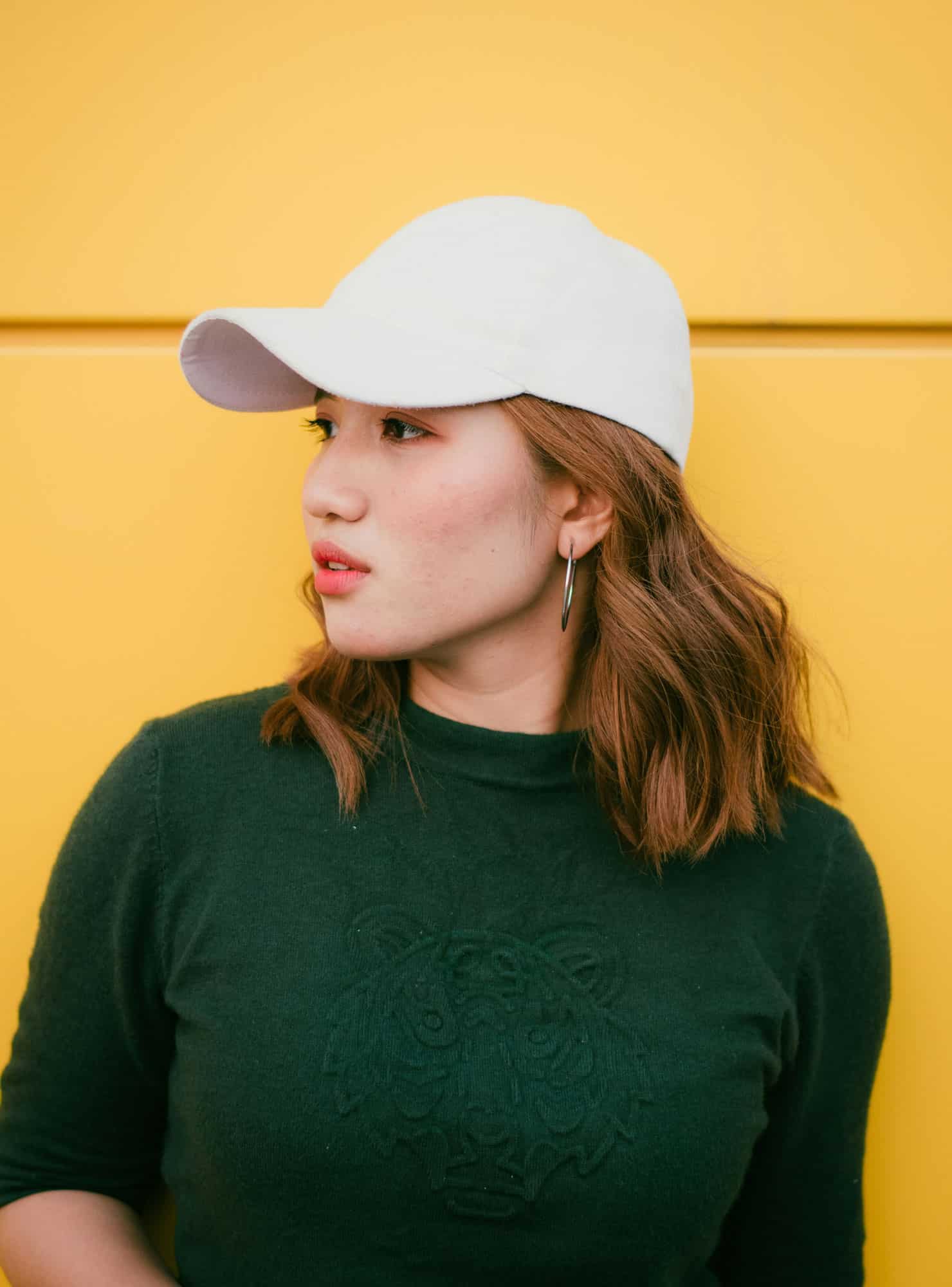 young woman with a cap